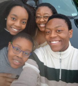 Tshepang Mahasha with her mother and two brothers with Autism